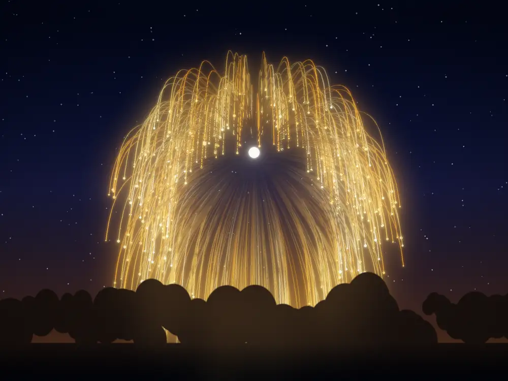 A single large golden willow burst hanging in the night sky